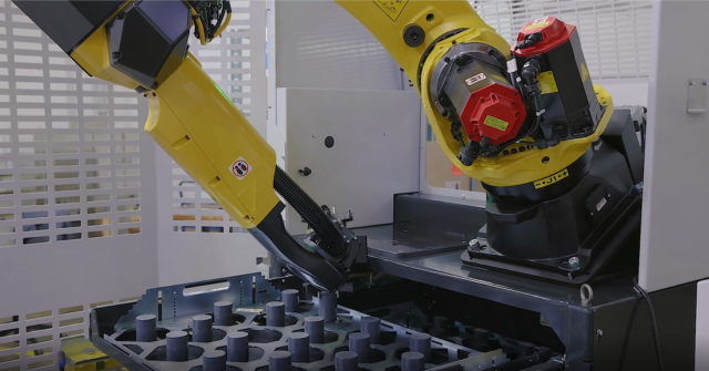 Cobot loads and unloads sample parts as a demo for MFG Day