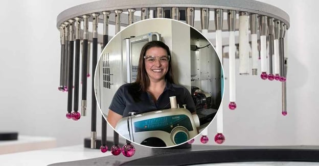 QA specialist Jordan Eisel in front of CNC mill