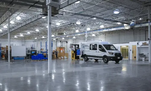 Delivery van gets loaded in production facility
