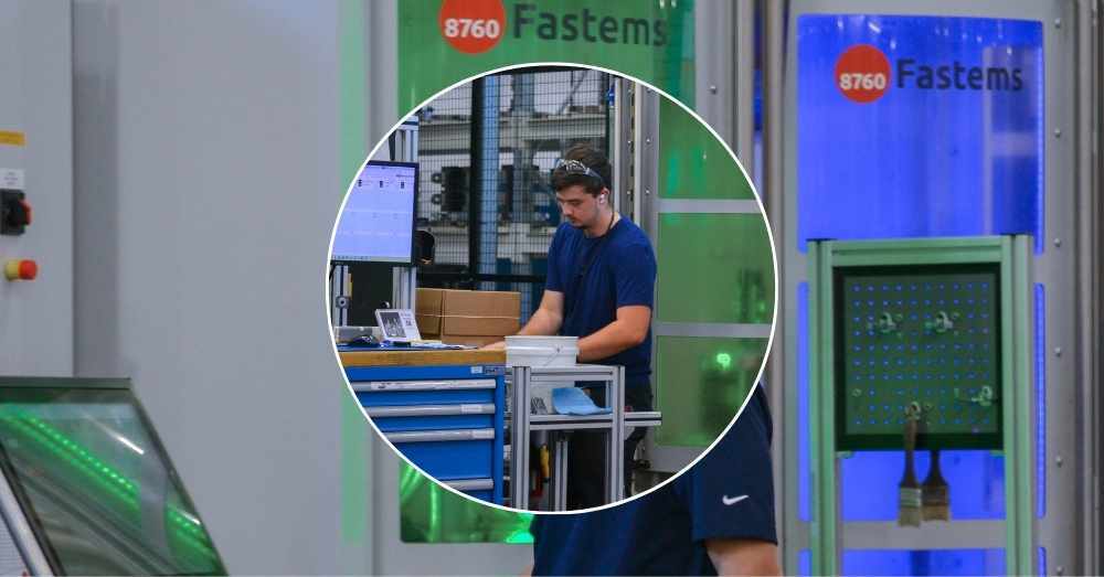 Machining intern inspects parts at Fastems FMS