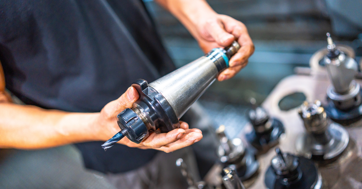 CNC machinist selects an end mill