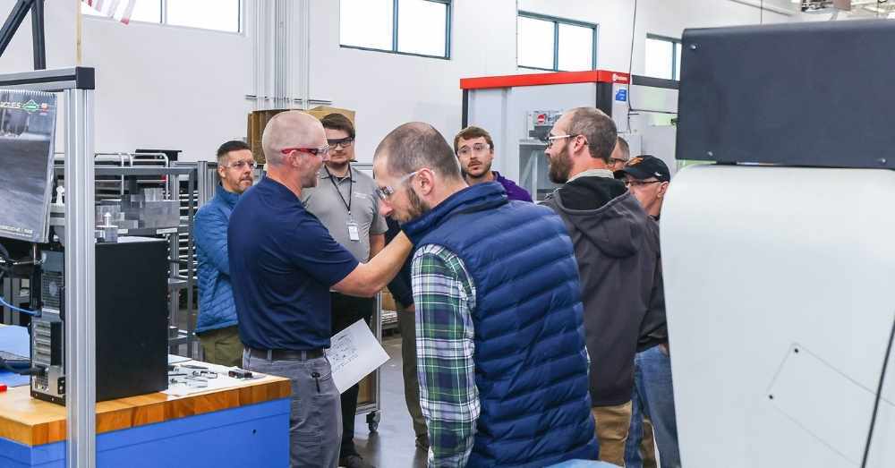 Manufacturing director takes customers on shop floor tour
