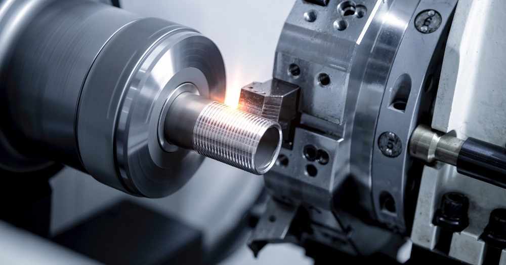 CNC lathe cuts external threads into cylindrical part